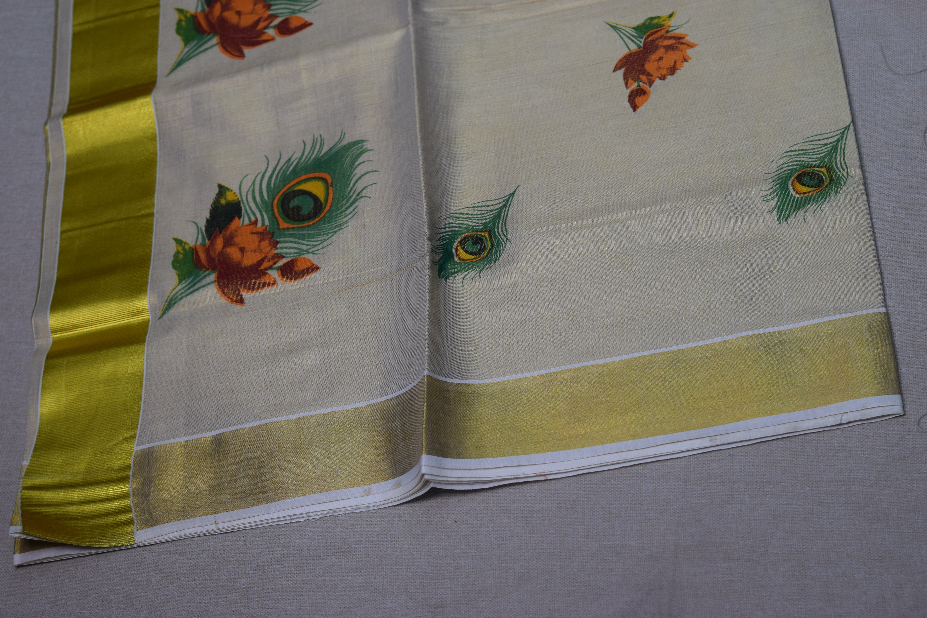 Kerala Kasavu Cotton Saree with Teal Tissue Pallu & Peacock Feather Block Print