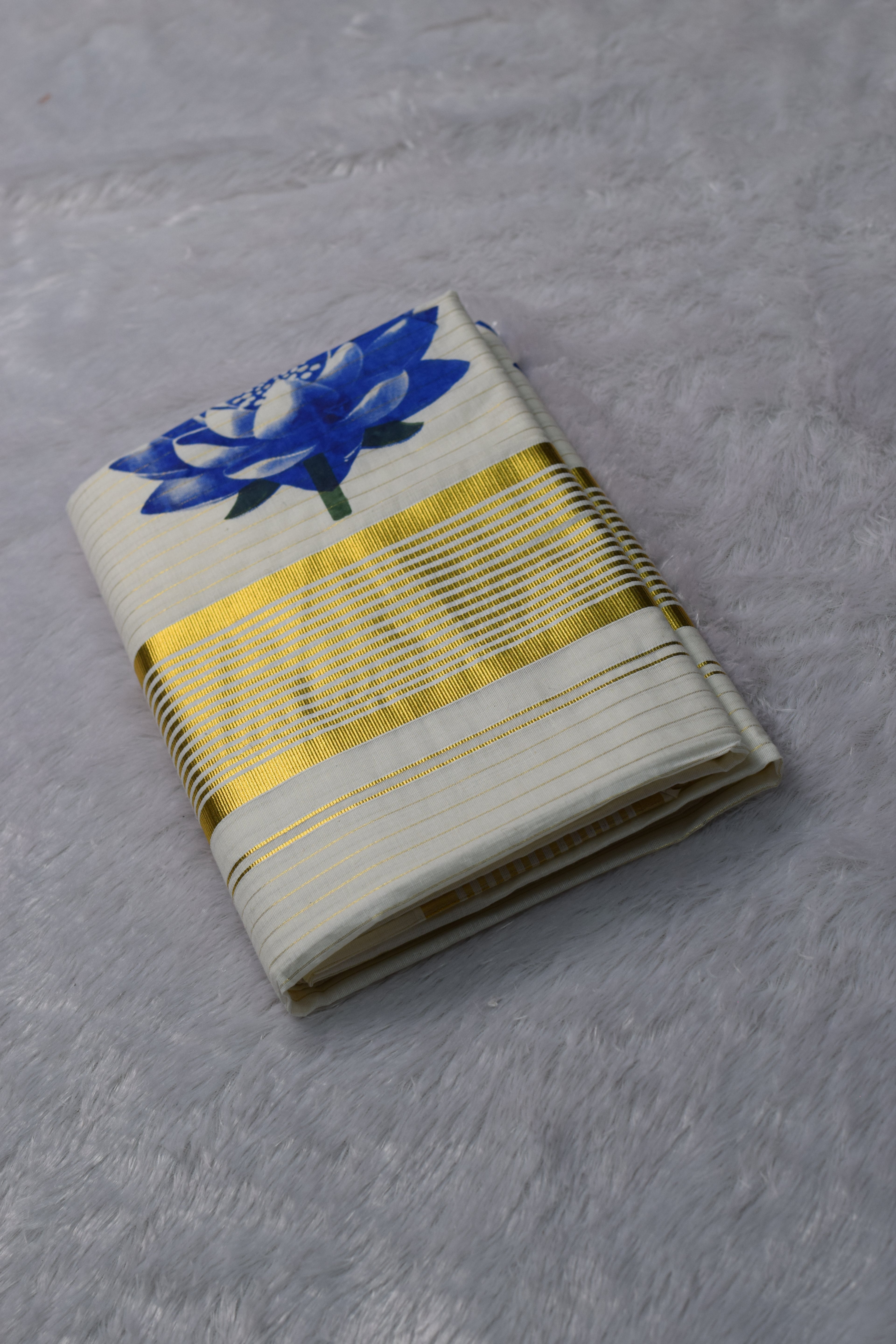 Kerala Kasavu Set Saree with Blue Floral Print & Golden Border