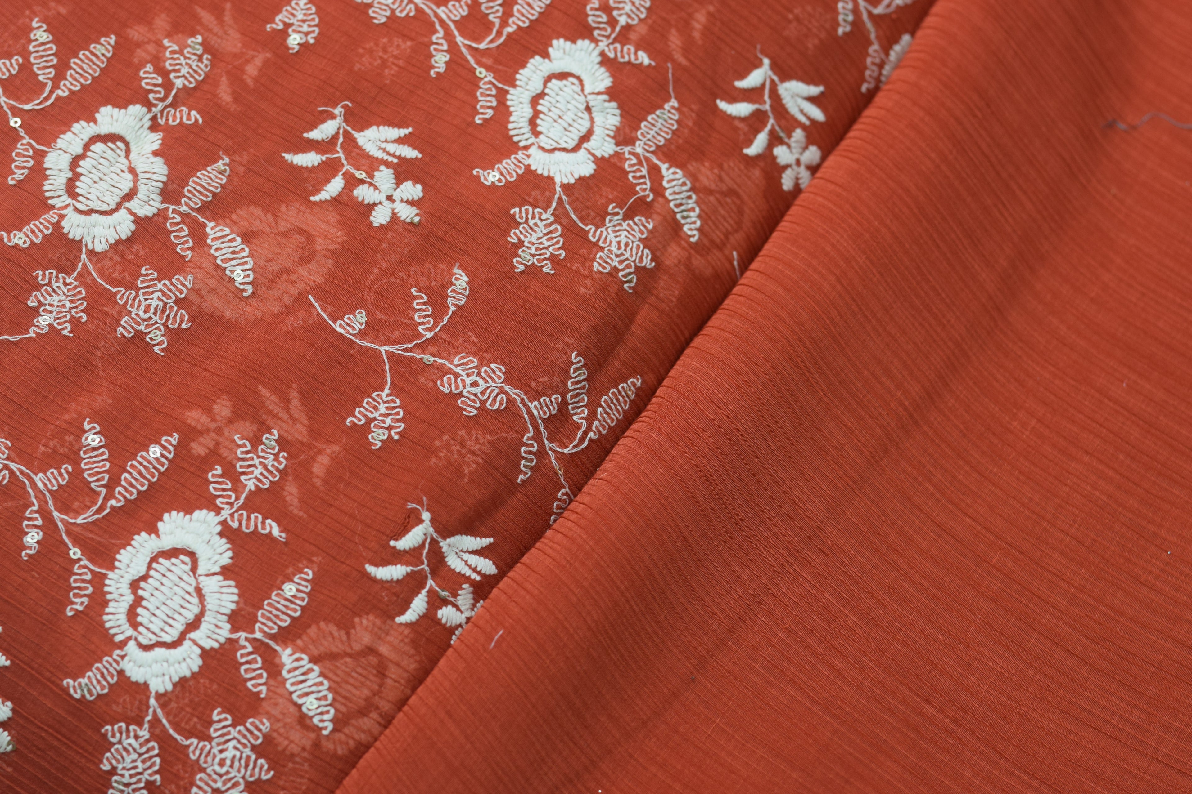 Rust Orange Crushed Georgette Fabric with Elegant White Floral Embroidery – - 44 Inches Width